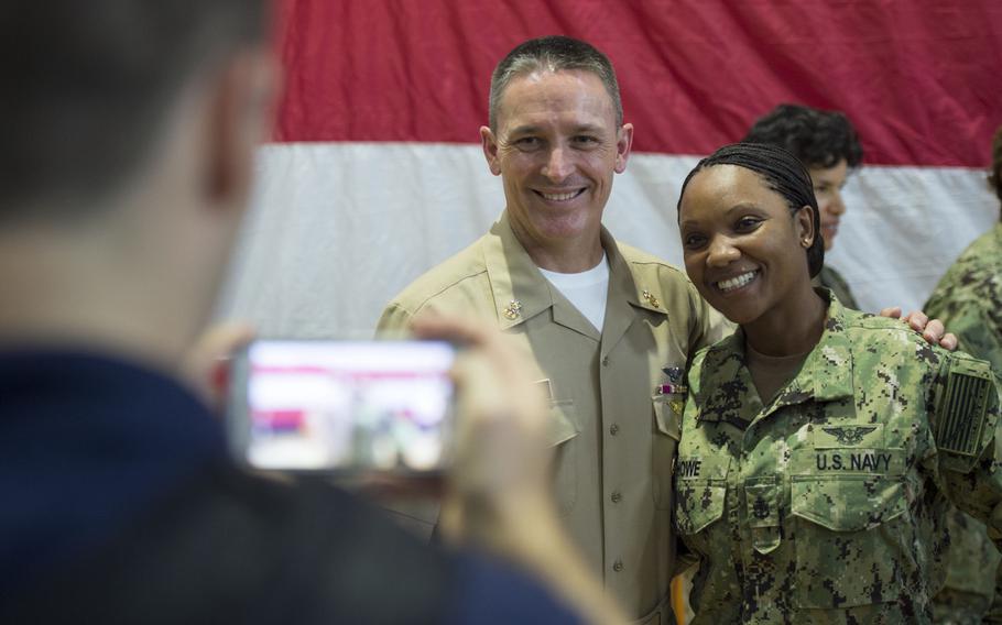 Master Chief Petty Officer of the Navy Mike Stevens poses for a picture with a chief following an all hands call at Naval Support Activity, Bahrain, on Sunday, Oct. 18, 2015.