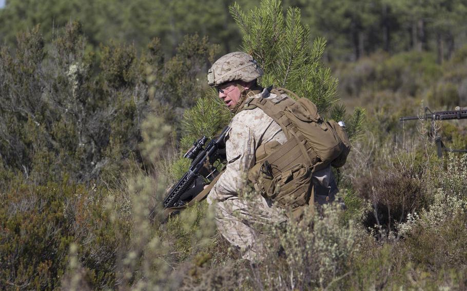 A U.S. Marine with Company F, 1st Platoon, Battalion Landing Team 2/6, 26th Marine Expeditionary Unit, prepares to attack a simulated defensive position during a live-fire exercise at Pinheiro Da Cruz, Portugal, Oct. 21, 2015.
