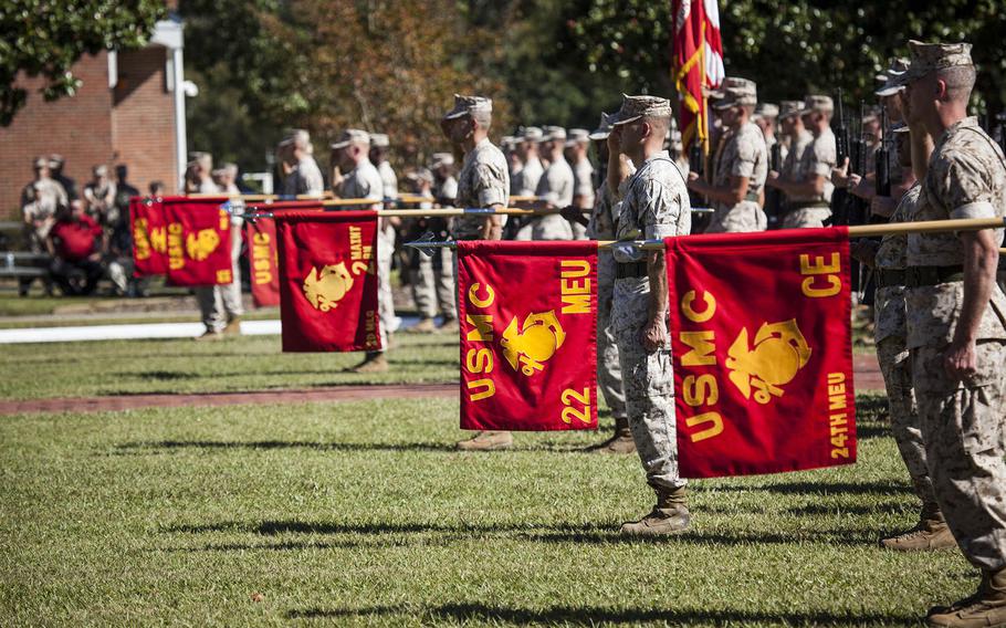 U.S. Marines with II Marine Expeditionary Force, salute during the II MEF change of command ceremony at Camp Lejeune, N.C., Oct. 22, 2015.