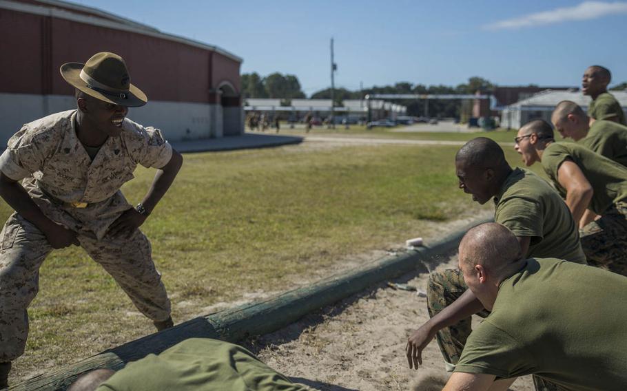Drill Instructor Sgt. Leon Booker, Platoon 3000, Company I, 3rd Recruit Training Battalion, encourages his recruits to push themselves through an incentive training session Oct. 20, 2015, at Parris Island, S.C.