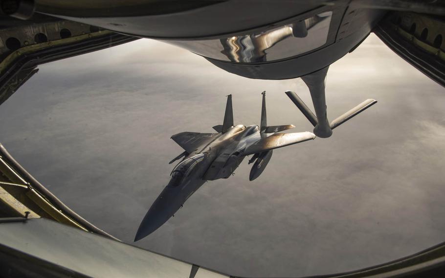 A F-15 Eagle from the 144th Fighter Squadron approaches a U.S. Air Force KC-135 Stratotanker during an air refuel mission in support of Vigilant Shield 16 on Tuesday, Oct. 20, 2015.