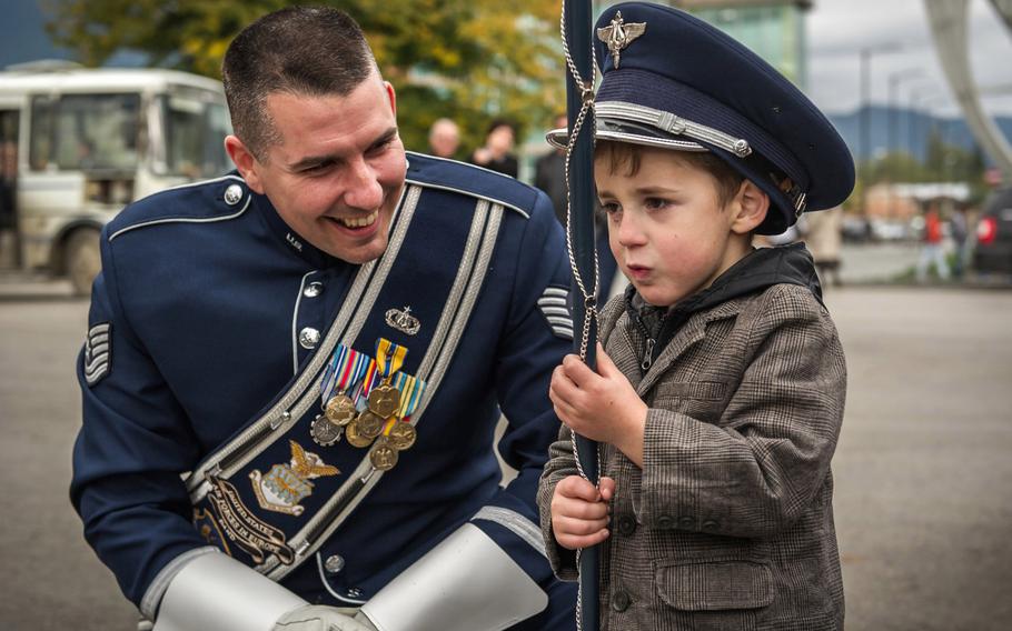 Tech. Sgt. John Dawson, a U.S. Air Forces in Europe Band drum major, poses for a photo with a Georgian boy after a marching band performance in Kvareli, Georgia, on Sunday, Oct. 18, 2015. Thirty-three bandsmen from the U.S. Air Forces in Europe Band traveled to the former Soviet republic for several events, including the First International Military Bands Festival in Tbilisi.