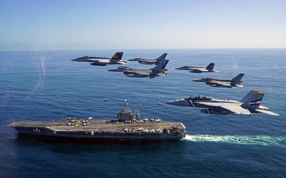 U.S. Naval aircraft and aircraft from the Chilean Air Force participate in a fly-by near the aircraft carrier USS George Washington Oct. 19, 2015.