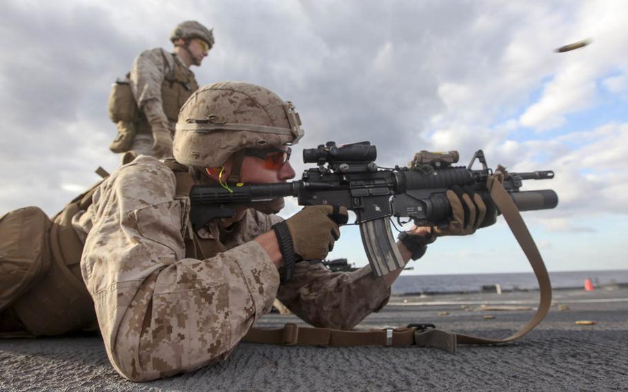 Marines and sailors with 2nd Platoon, Company E, Battalion Landing Team 2/6, conduct close-quarter firing drills in the Mediterranean Sea aboard the USS Oak Hill Oct. 29, 2015. The live-fire exercise provided an opportunity for the platoon to practice marksmanship and increase the unit's shooting proficiency. The 26th Marine Expeditionary Unit is deployed to the 6th Fleet area of responsibility in support of U.S. national security interests in Europe.