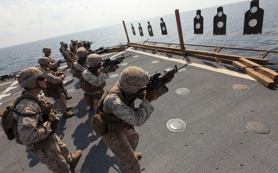 Marines and sailors with Company E, Battalion Landing Team 2nd Battalion, 6th Marines, conduct close-quarter firing drills in the Gulf of Aden aboard the USS Oak Hill, Nov. 7, 2015.