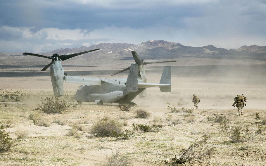 A Marine with Transportation Services Company, Combat Logistics Battalion 2, carries a simulated casualty to an MV-22 Osprey for a medical evacuation during a live-fire vehicle recovery exercise as part of Integrated Training Exercise 1-16 at Marine Air Ground Combat Center Twentynine Palms, Calif., Nov. 4, 2015.