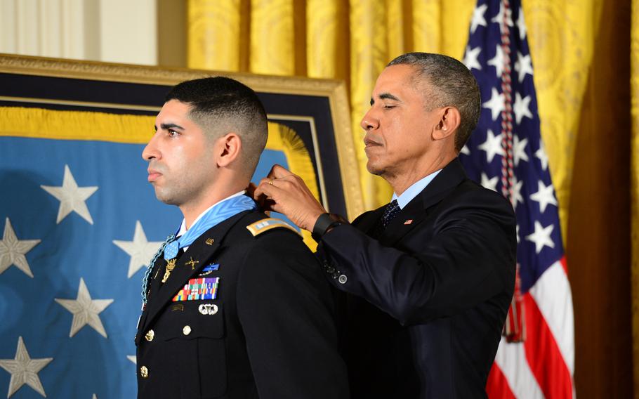 President Barack Obama presents the Medal of Honor to retired U.S. Army Capt. Florent Groberg during a ceremony at the White House in Washington, Nov. 12, 2015.
