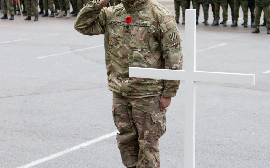 Lt. Col. Johnny Evans, commander of 3rd Battalion, 69th Armor Regiment, 1st Armor Brigade Combat Team, 3rd Infantry Division, salutes after laying a wreath during a Remembrance Day ceremony at General Aldolfas Romanauskas Warfare Training Center in Nemecine, Lithuania, Nov. 11, 2015.