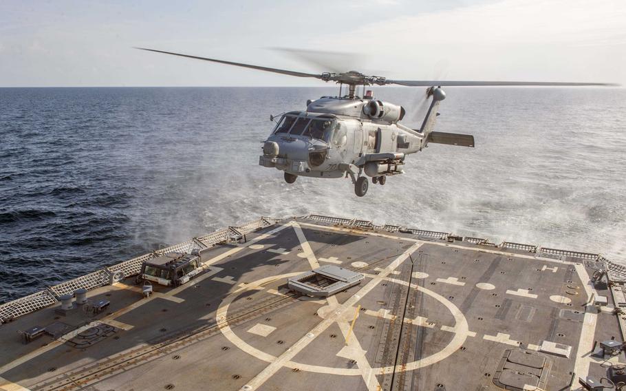 An MH-60R Sea Hawk helicopter lands on the flight deck of guided-missile destroyer USS Bulkeley Nov. 17, 2015.