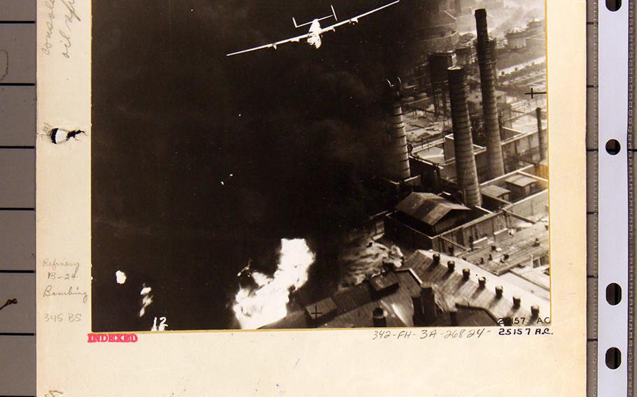 Sternfel's bomber "The Sandman," shown in this photographed National Archives document, was photographed in one of the most iconic images of the air war in World War II. The picture shows Sternfels emerging from a heavy smoke and fires just as he clears the target. As none the bomber’s open windows and gun turrets could not be spared for a camera, crews attached a mirror out of the back of the plane. The image that was later widely reproduced, and played on the Stars and Stripes front page and multiple books is reversed.