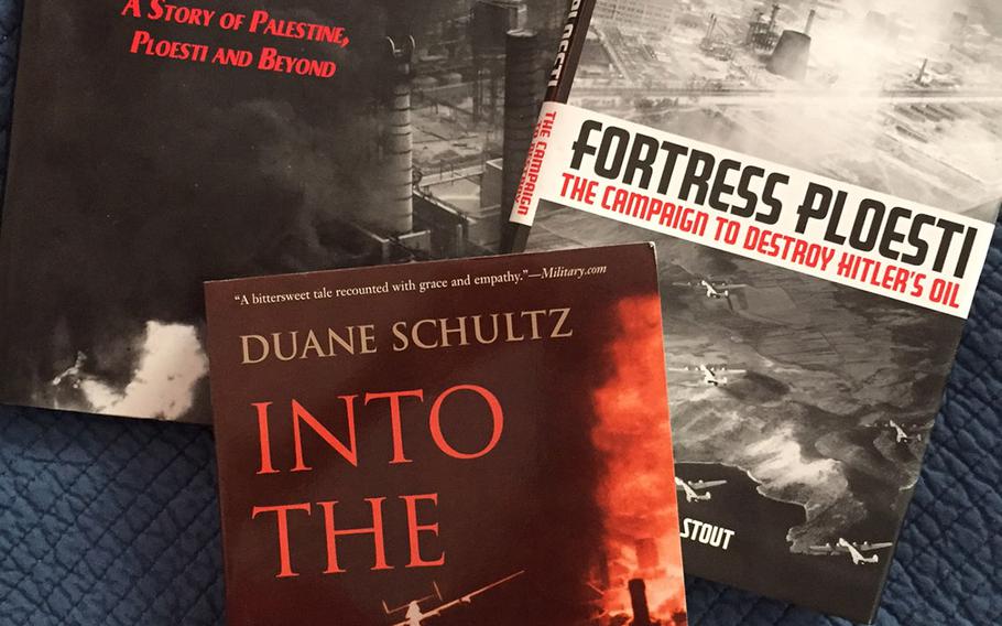 In the years following Operation Tidal Wave the photo of Sternfels' bomber emerging from the smoke appeared backwards in multiple publications, including the covers of two of these books and the interior photos of the third.