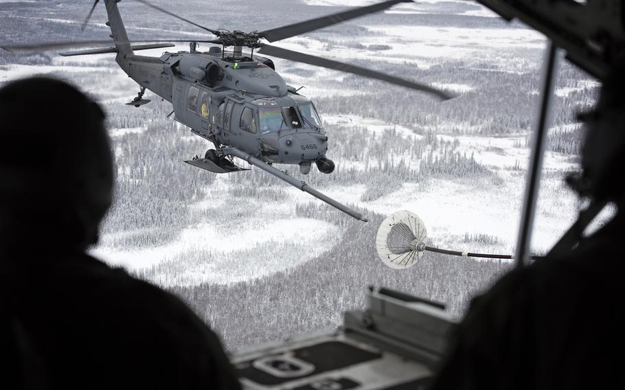 Col. Harlie Bodine, commander of the 611th Air and Space Operations Center, spent the day with the 176th Wing, Alaska Air National Guard's rescue squadrons during an immersion flight, Nov. 24, 2015, in and around the Joint Base Elmendorf-Richardson area. The day;s demonstrations included an air refueling mission in which an HH-60G Pave Hawk helicopter was refueled by an HC-130 King aircraft, as well as a hoist extraction demo from a Pave Hawk.
