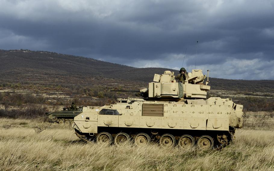 Bulgarian and U.S. soldiers make offensive movement on the enemy with a Boyevaya Mashina Pekhoty 1 and a Bradley Fighting Vehicle during Exercise Peace Sentinel at Novo Selo Training Center, Bulgaria, Nov. 22, 2015.