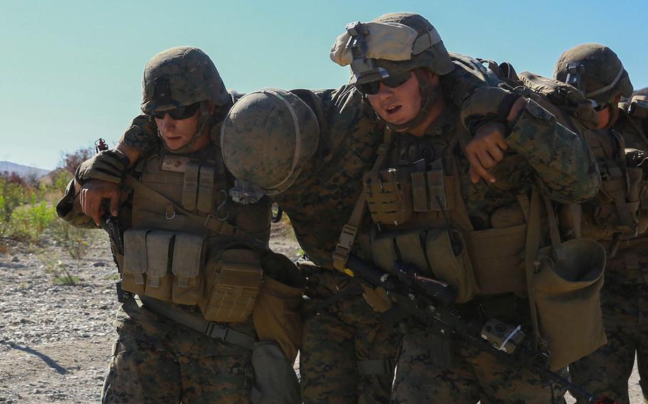 Marines with 1st Law Enforcement Battalion, I Marine Expeditionary Force Headquarters Group, I Marine Expeditionary Force evacuate a simulated casualty during mobile immersion training aboard Marine Corps Base Camp Pendleton, Calif., Nov. 20, 2015.