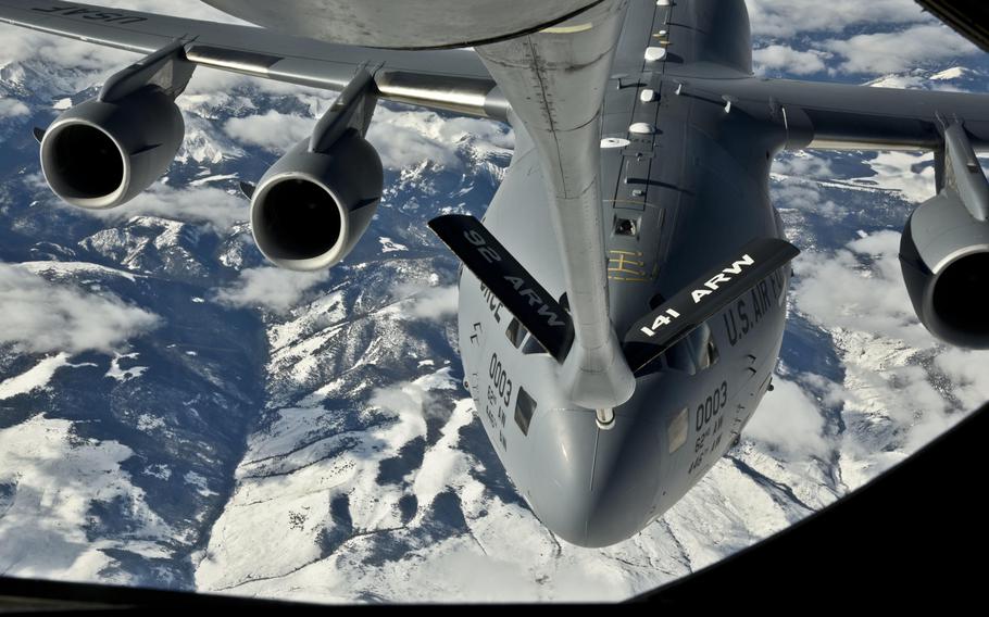 A C-17 Globemaster III from Joint Base Lewis-McChord, Wash., receives fuel from a 92nd Air Refueling Wing KC-135 Stratotanker on Thursday, Nov. 12, 2015, over Washington.