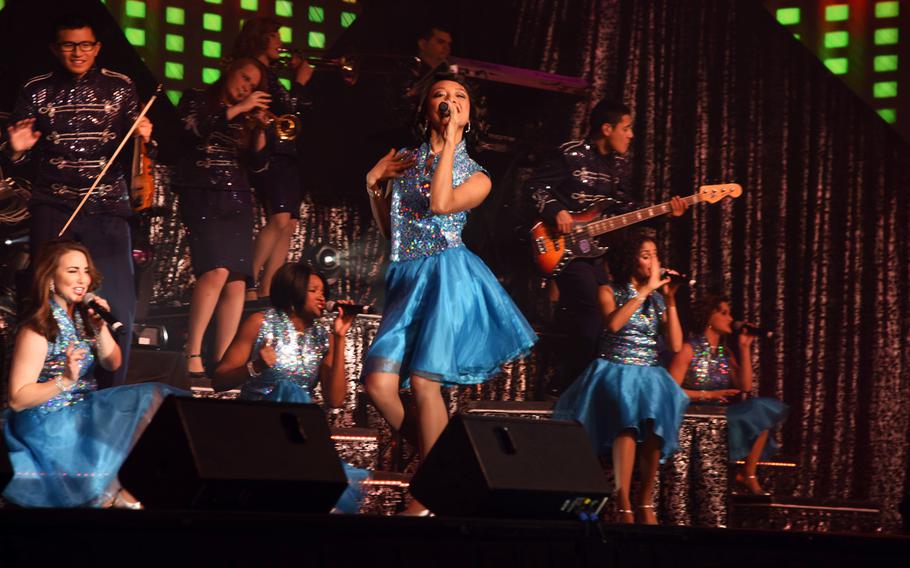 Senior Airman Christine David, U.S. Air Force Tops in Blue performer, solos during the group's Nov. 28, 2015, performance at the Montana Expo Park in Great Falls, Mont. The group performed pop songs and classic hits spanning from the 1920s to current day.