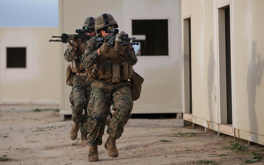 1st Battalion, 1st Marine Regiment infantrymen tactically move from building to building in a simulated combat zone during Exercise Steel Knight 2016 at Marine Corps Base Camp Pendleton, Calif., Dec. 4, 2015.