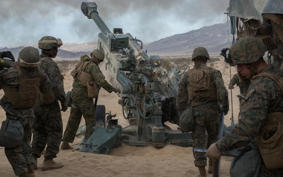Marines with Battery I, 3rd Battalion, 11th Marine Regiment, 1st Marine Division, fire an M777 Howitzer during the opening day of live-fire operations for Steel Knight at Marine Corps Air Ground Combat Center Twentynine Palms, Calif., on Dec. 10, 2015.