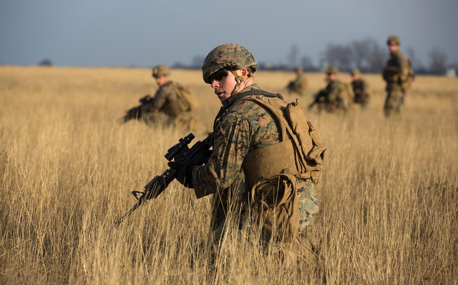 U.S. Marines with Combined Arms Company, Black Sea Rotational Force, conduct field training with Romanian and Moldovan armed forces during Platinum Lynx 16-2 at Smardan Training Area, Romania, Dec. 9, 2015.
