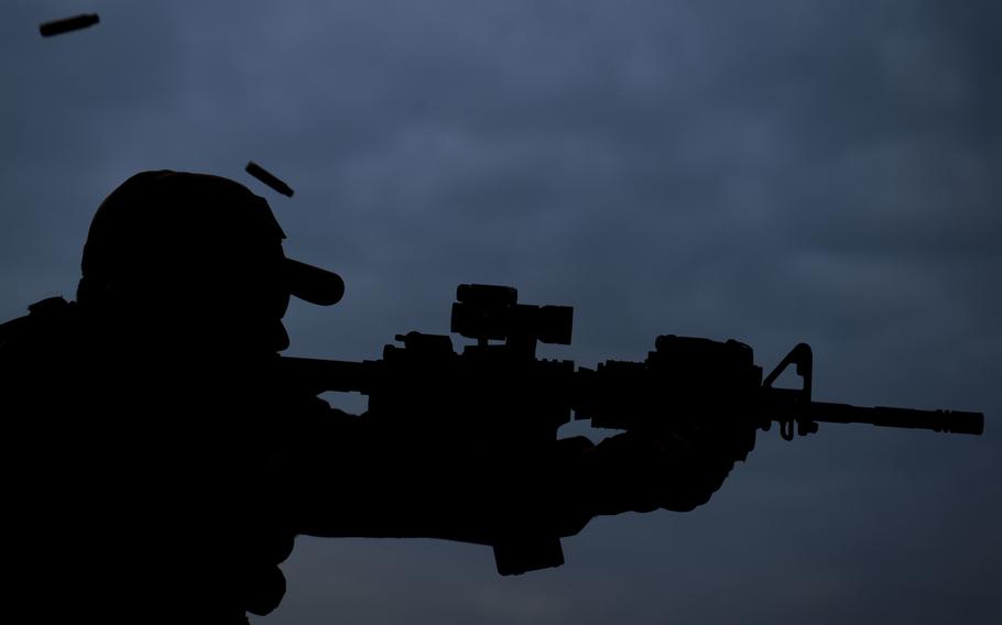 Tech. Sgt. Stephen Upton shoots an M-16 rifle on a firing range near Kabul, Afghanistan, on Tuesday, Dec. 8, 2015.