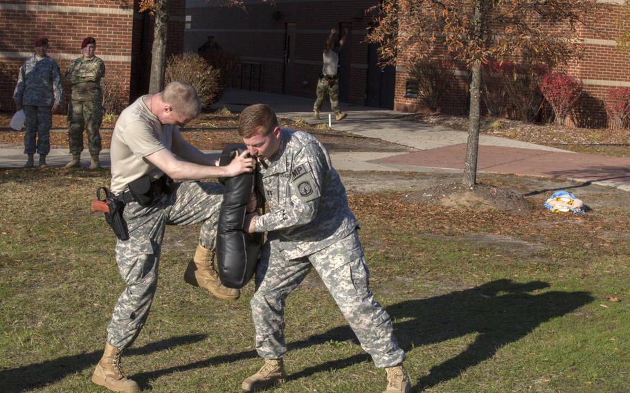 U.S. Army soldiers assigned to the 503rd Military Police Battalion (Airborne), Fort Bragg, N.C., endured oleoresin capsicum spray (pepper spray) contamination and conducted fight-through drills Dec. 8, 2015.