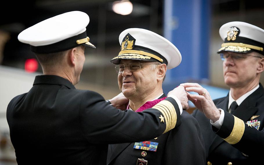 Chief of Naval Operations Adm. John Richardson presents Commander of Turkish Naval Forces Adm. B?lent Bostanoglu with the Legion of Merit during a full honors ceremony at the Washington Navy Yard Dec. 8, 2015.