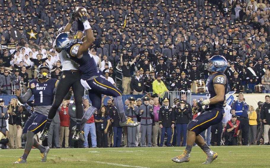 Navy Safety Daiquan Thomasson makes the game-clinching interception in the 116th Army-Navy game, Dec. 12, 2015. Navy won the game, 21-17.