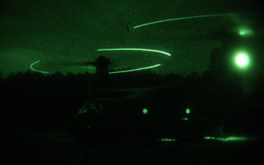 An MV-22B Osprey, operated by a crew with Marine Medium Tiltrotor Training Squadron 204, lands during a nighttime external lifts operation at Camp Lejeune, N.C., Dec. 14, 2015.