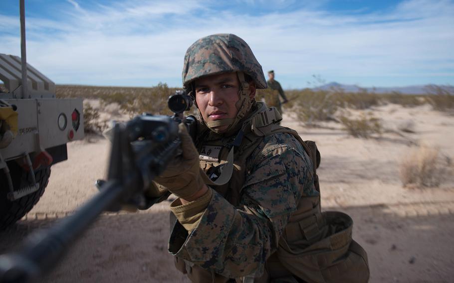 A Marine holds security during a route clearance drill as a part of Exercise Steel Knight at Marine Corps Air Ground Combat Center Twentynine Palms, Calif., Dec. 13, 2015.