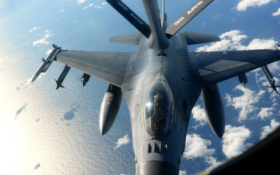 An F-16 Fighting Falcon receives fuel from a KC-135R Stratotanker during Exercise Razor Talon, Dec. 14, 2015, over the coast of North Carolina. The aircrew and other support units from several  bases conducted training missions aimed at bolstering cohesion between forces.