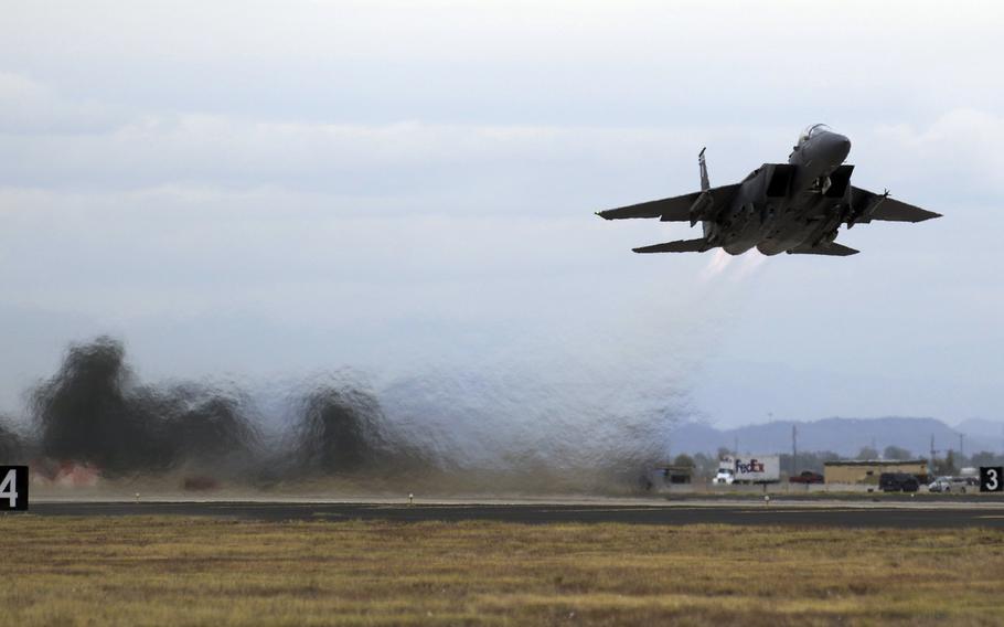 An F-15SG from the 428th Fighter Squadron takes off at Luke Air Force Base, Ariz., Dec. 11, 2015. The F-15s came in support of the training exercise Forging Sabre from Mountain Home Air Force Base, Idaho. Forging Sabre is an exercise involving the 428th Fighter Squadron, Luke AFB 425th Fighter Squadron and members of Singapore's armed forces. The exercise includes night and weekend flying operations at Luke Air Force Base and the Barry M. Goldwater Range complex.