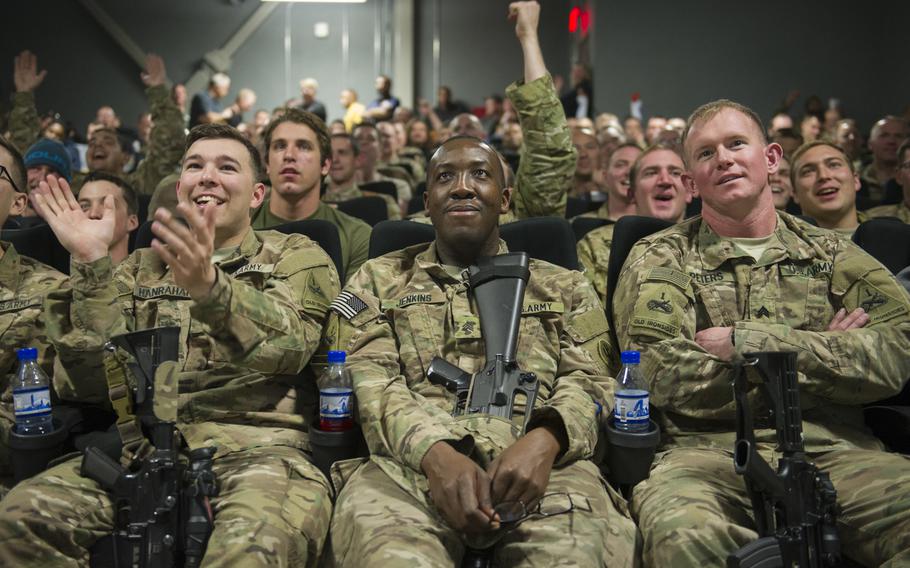 Servicemembers deployed to Bagram Air Field, Afghanistan, clap and cheer as they prepare to view a first showing of ''Star Wars: The Force Awakens,'' here, Dec. 22, 2015. The Army & Air Force Exchange Service partnered with Walt Disney Studios to give servicemembers a chance to see the movie in a deployed location.