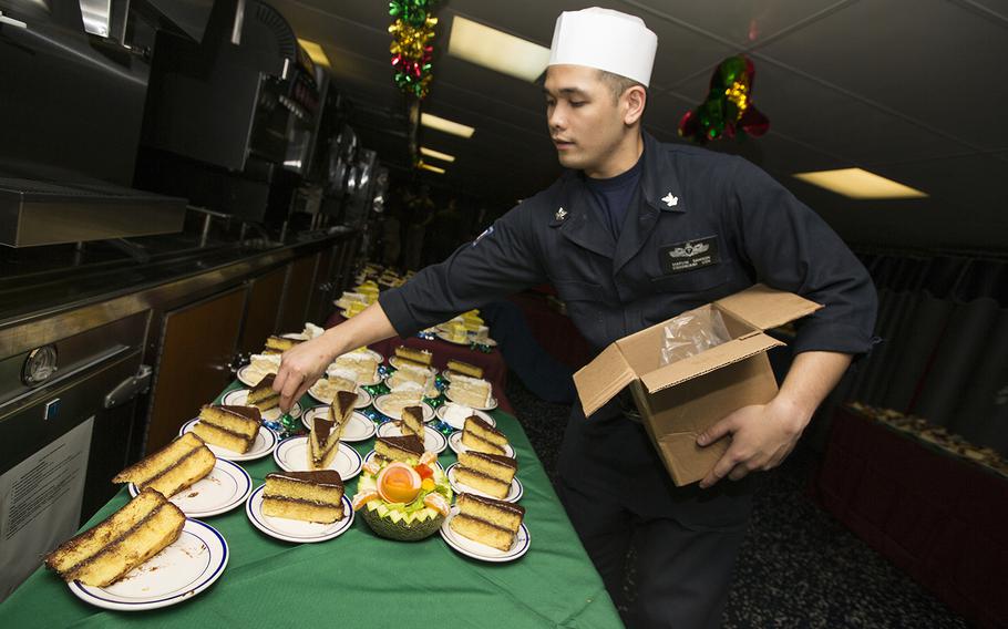U.S. Navy Culinary Specialist 2nd Class Marvin Samson, with the Kearsarge Amphibious Ready Group, prepares pies for the Christmas meal aboard the amphibious assault ship USS Kearsarge, in the Persian Gulf, Dec. 22, 2015.