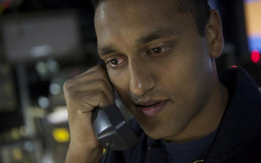 Petty Officer 2nd Class Syed Balkhi, from West Palm Beach, Fla., aboard the guided-missile destroyer USS Carney, speaks with President Barack Obama on  Dec. 25, 2015.