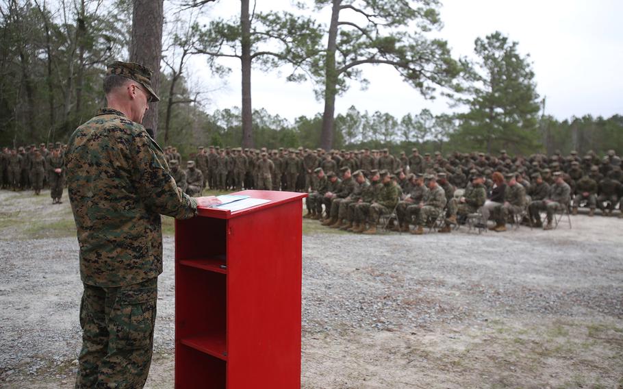 U.S. Navy Capt. Bill Muhm, 2nd Marine Logistics Group chaplain, leads the Marines and sailors in prayer during the ribbon-cutting ceremony to unveil the newly renovated 2nd MLG Corporals Course facility at Camp Lejeune, N.C., Jan. 6, 2016.