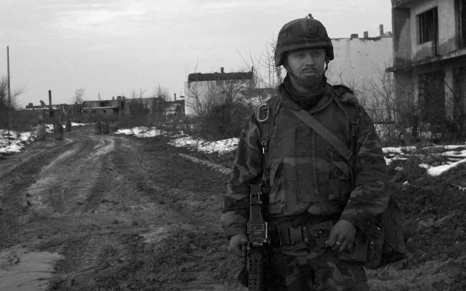 Cpl. Miguel Medina, infantryman out of Kirch-Goens, Germany, at desolate checkpoint Number 9 near Omerbegovaca, Bosnia-Herzegovina in February 1996. Troops called it the Violators' Checkpoint, but they wouldn't say why.