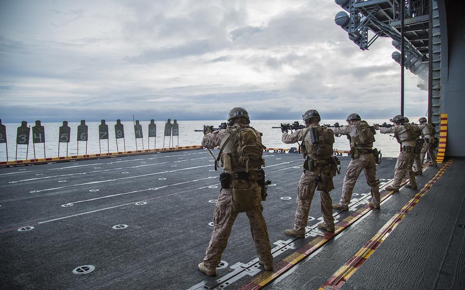 U.S. Marines with Maritime Raid Force, 13th Marine Expeditionary Unit, conduct a deck shoot during a sustainment exercise aboard the USS Boxer, Jan.18, 2016.