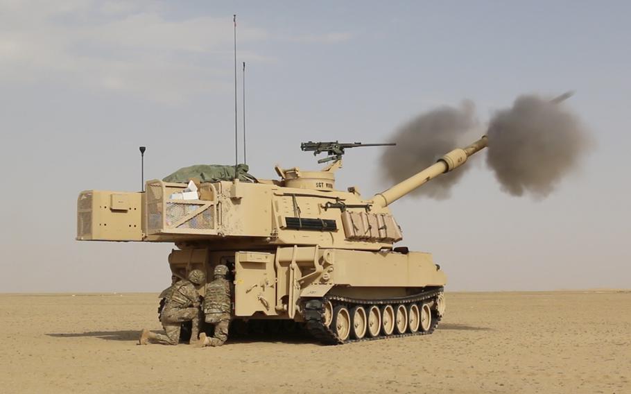 Soldiers assigned to 2nd Armored Brigade Combat Team, 1st Infantry Division, fire a 155mm artillery round from an M109A6 Paladin during a live-fire exercise at Camp Buehring, Kuwait, Jan. 19, 2016.