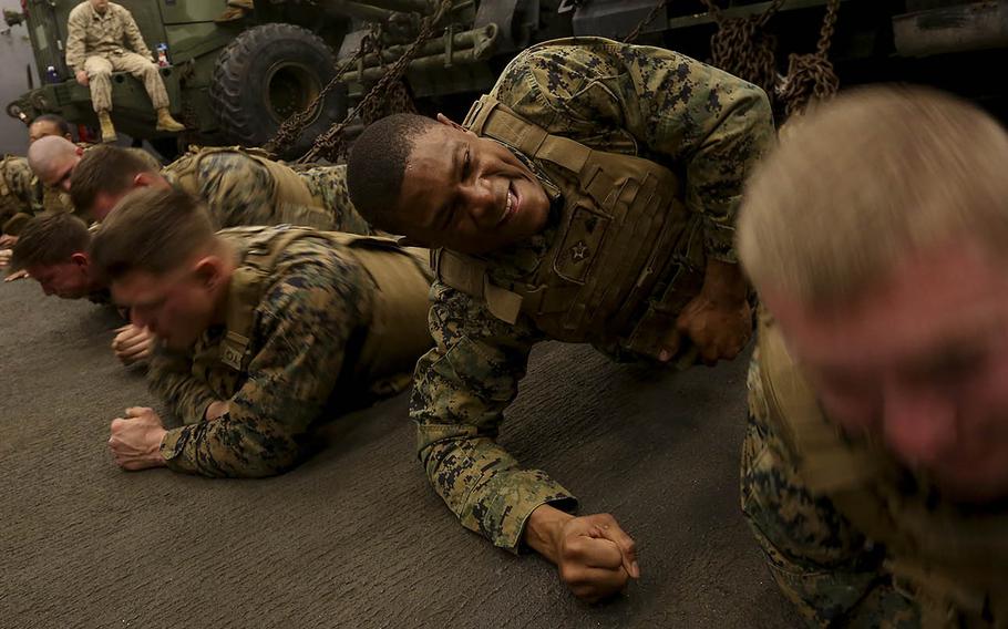 U.S. Marine Cpl. Christopher Johnson, a fire team leader with 2nd Platoon, Battalion Landing Team 2/6, completes a side plank exercise during a Marine Corps Martial Arts Program course held on the USS Oak Hill in the Arabian Sea, Jan. 27, 2016.