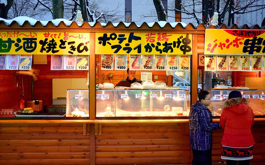 Food vendors are already open for business in Sapporo, Japan's Odori Park Feb. 3, 2016. The Sapporo Snow Festival is scheduled to start Friday, Feb. 5 with the final displays being taken down by February 18.