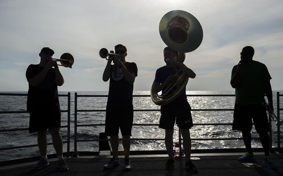 Members of the 7th Fleet Band perform aboard the Ticonderoga-class guided-missile cruiser USS Antietam during a ''steel beach picnic'' Jan. 31, 2016.