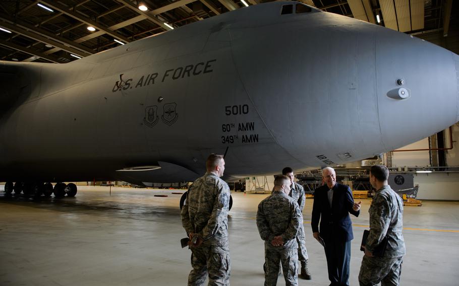 Sam E. Parish, retired chief master sergeant of the Air Force, interacts with airmen of the 721st Aircraft Maintenance Squadron, Jan. 27, 2016, at Ramstein Air Base, Germany. Airmen from the 521st Air Mobility Operations Wing had met Parish and discussed the differences from when Parish enlisted and how things are now in the Air Force.