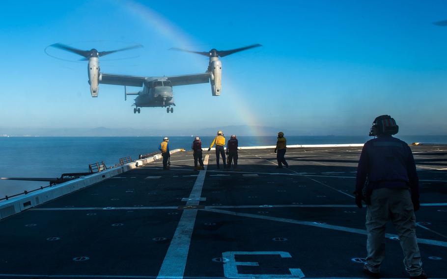 Sailors and Marines aboard amphibious transport dock ship USS New Orleans signal an MV-22 Osprey from Medium Tilt Rotor Squadron onto the flight deck. More than 4,500 sailors and Marines from the Boxer Amphibious Ready Group and 13th Marine Expeditionary Unit departed San Diego on Feb. 13, 2016, for a deployment to the 3rd, 5th and 7th Fleet areas of operations.