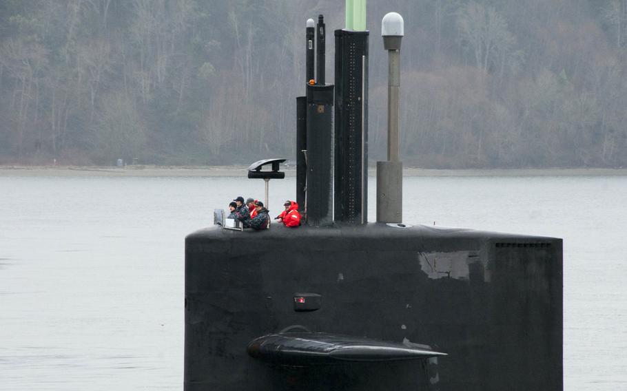 The Gold Crew of the Ohio-class ballistic-missile submarine USS Henry M. Jackson transits the Hood Canal on Feb. 15, 2016, as the boat returns home to Naval Base Kitsap-Bangor following a routine strategic deterrent patrol.