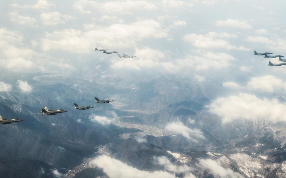 Four U.S. Air Force F-22 "Raptor" fighter aircraft from Kadena Air Base, Japan, fly over South Korea, in response to recent provocative action by North Korea, Feb. 17, 2016. The Raptors were joined by four F-15 Slam Eagles and U.S. Air Force F-16 Fighting Falcons.
