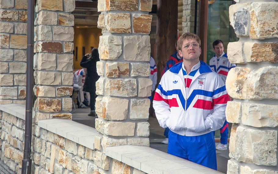 Taron Egerton, who plays the lead role in "Eddie the Eagle," is caught in a contemplative moment at the entrance of Edelweiss Lodge and Resort, which is owned by the U.S. Dept. of Defense and serves American military members and their families. In this scene, Eddie takes a wistful look at the mountains after he arrives at the 1988 Olympics in Calgary, Alberta, Canada.