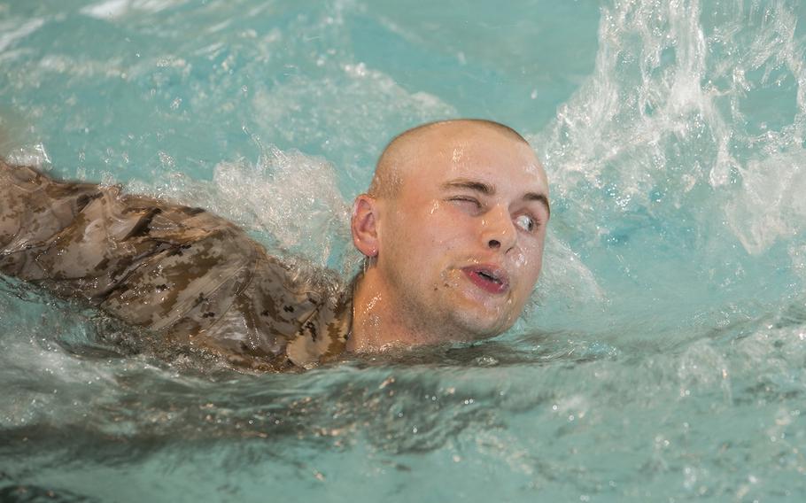 Hunter J. Woodard, a Marine recruit with Platoon 2026, Company E, 2nd Recruit Training Battalion, swims 25 meters during basic water survival training Feb. 22, 2016, on Parris Island, S.C.