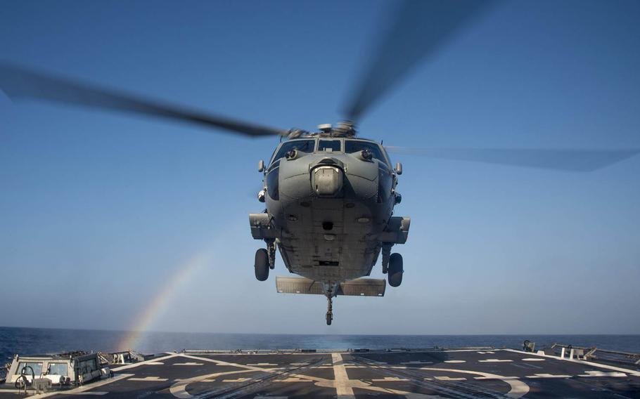 An MH-60R Sea Hawk helicopter of the Helicopter Maritime Squadron lands on the flight deck of the guided-missile destroyer USS Chung-Hoon on Feb. 23, 2016.