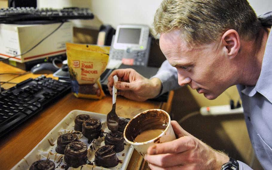 Dan Johnson, makes a batch of "Dead Elvis" at Bagram Airfield, Afghanistan, on Feb. 16, 2016. The "Dead Elvis" is a deployed confection created using peanut butter Oreos, bacon and chocolate.