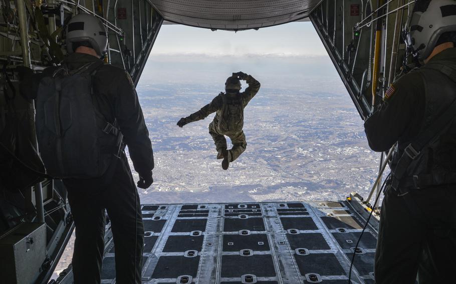 Tech. Sgt. Benjamin Jonas, 374th Operations Support Squadron survival, evasion, resistance and escape operations NCO in charge, jumps out of a C-130 Hercules while flying over Yokota Air Base, Japan, March 2, 2016. During the high-altitude, low-opening airdrop, Jonas jumped from 10,000 feet and parachuted to the base.